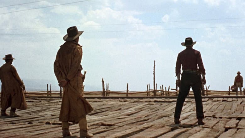 A lone figure against a vast desert landscape evoking Once Upon a Time in the West